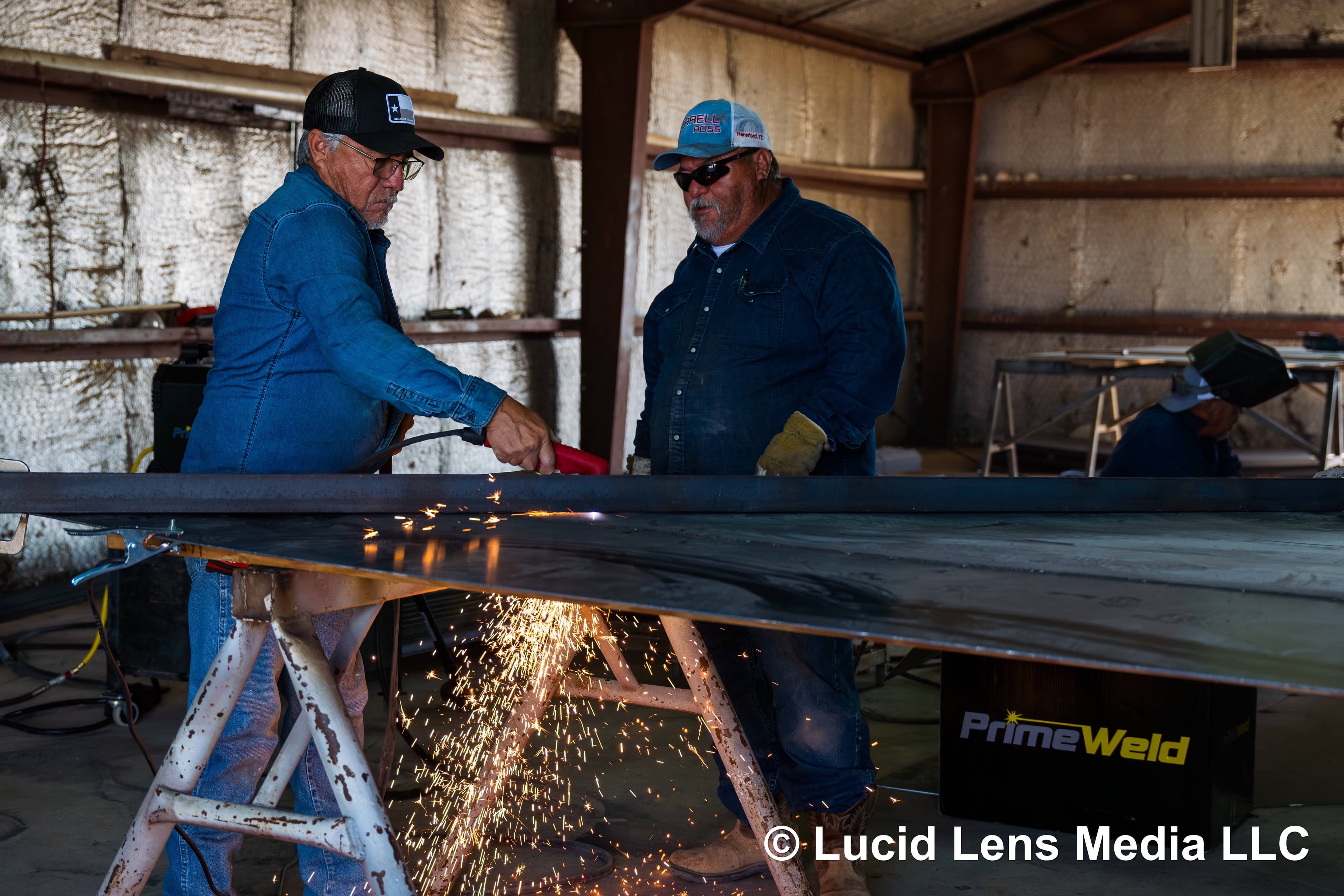 2 Men using plasma cutter