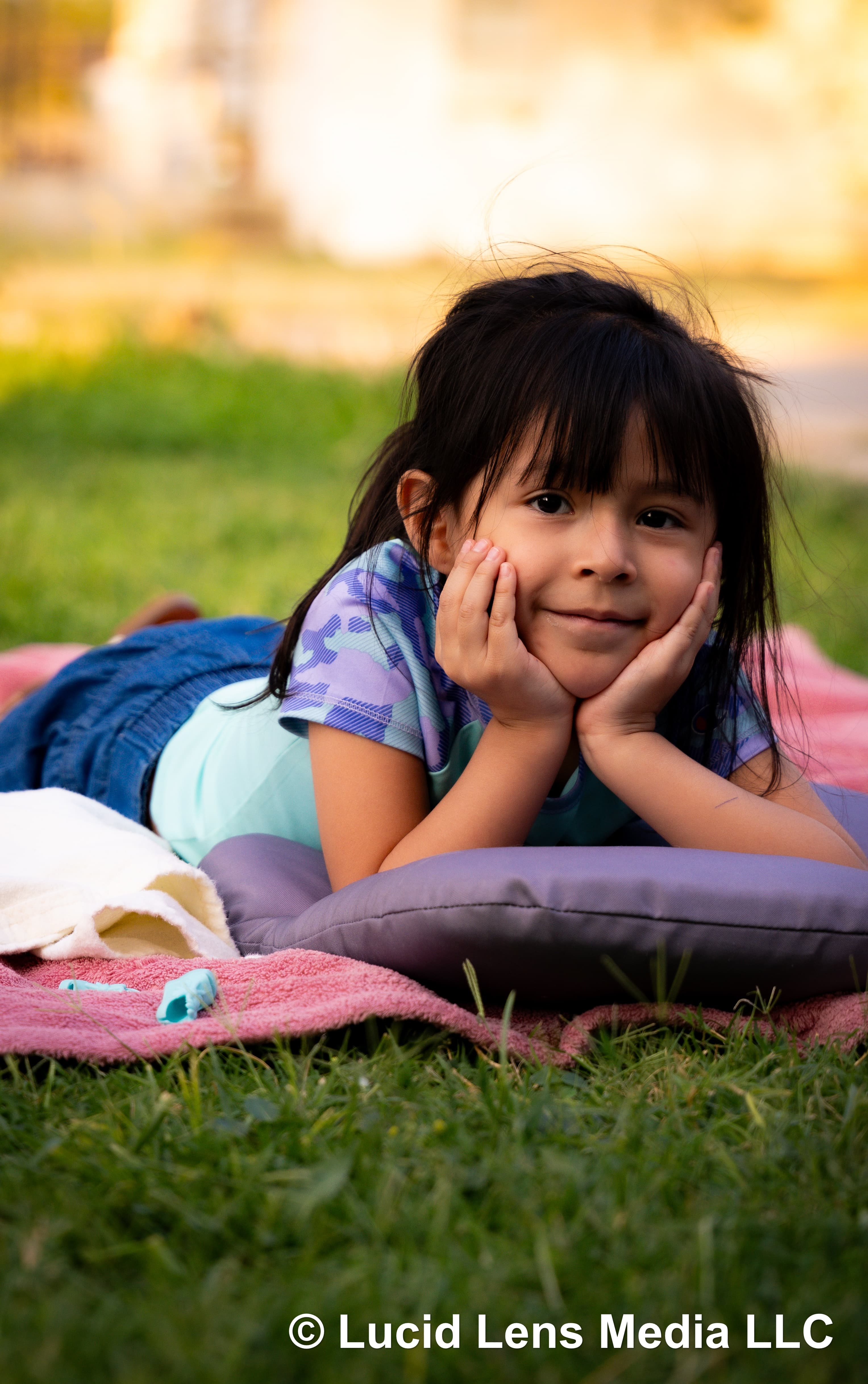 Little girl on blanket